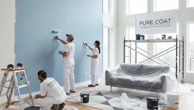Professional interior house painters finishing living room walls in Vancouver, WA